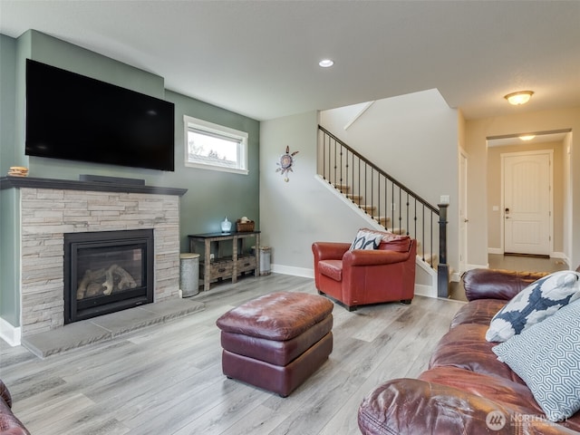 4206 NE 132nd St, Vancouver, WA 98686 - living room with stairway, a stone fireplace, wood finished floors, baseboards, and recessed lighting