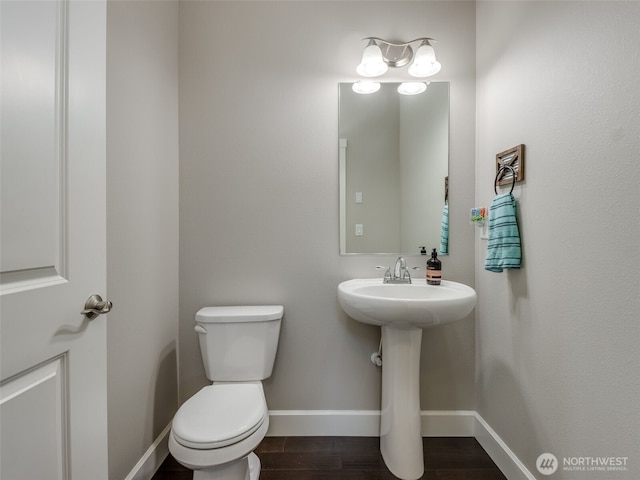 4206 NE 132nd St, Vancouver, WA 98686 - half bathroom featuring a sink, toilet, wood finished floors, and baseboards