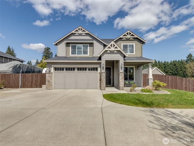 4206 NE 132nd St, Vancouver, WA 98686 - craftsman-style house featuring a garage, stone siding, concrete driveway, and fence