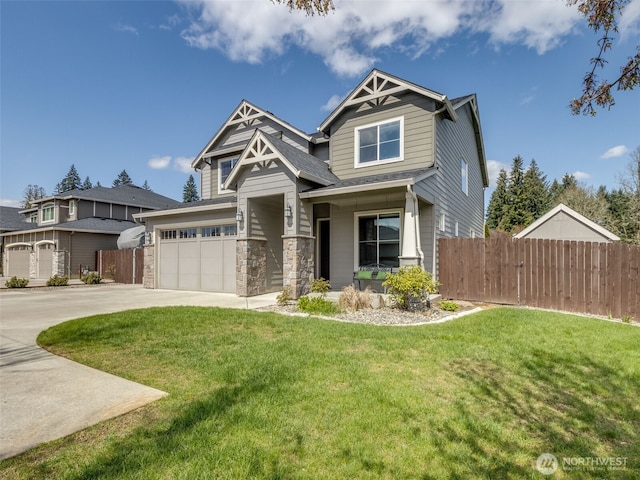 4206 NE 132nd St, Vancouver, WA 98686 - craftsman-style home with fence, stone siding, a front yard, and concrete driveway