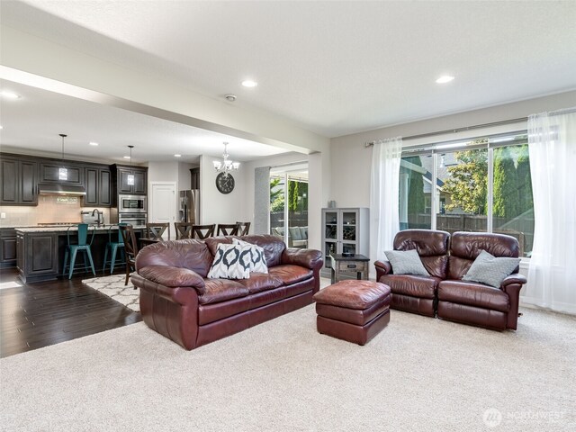 4206 NE 132nd St, Vancouver, WA 98686 - living room with recessed lighting, plenty of natural light, a chandelier, dark wood-style flooring, and dark colored carpet