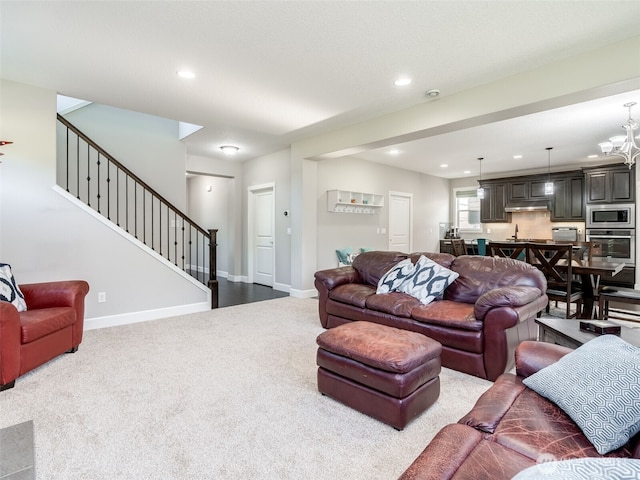 4206 NE 132nd St, Vancouver, WA 98686 - living room with dark carpet, stairs, recessed lighting, baseboards, and a chandelier