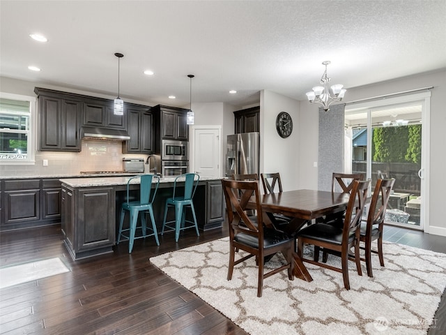 4206 NE 132nd St, Vancouver, WA 98686 - dining area featuring a chandelier, dark wood-type flooring, and recessed lighting