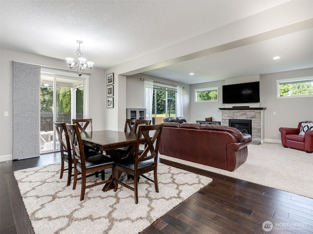 4206 NE 132nd St, Vancouver, WA 98686 - dining room with a fireplace, baseboards, a chandelier, dark wood-style floors, and recessed lighting