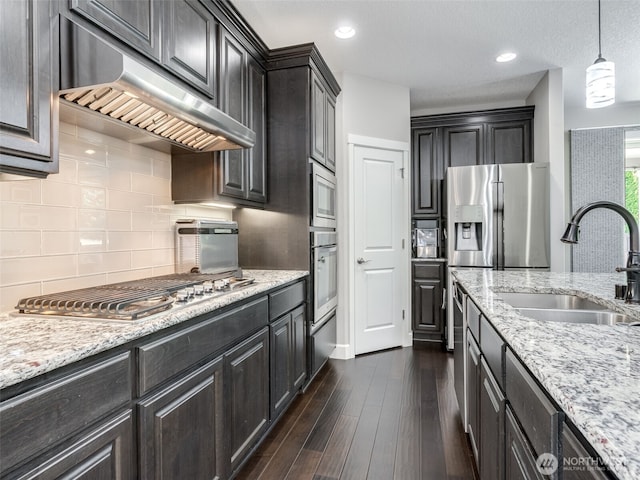 4206 NE 132nd St, Vancouver, WA 98686 - kitchen with extractor fan, a sink, appliances with stainless steel finishes, tasteful backsplash, and dark wood-style floors
