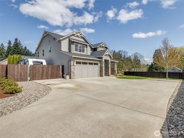 4206 NE 132nd St, Vancouver, WA 98686 - view of property exterior featuring concrete driveway, an attached garage, and stone siding