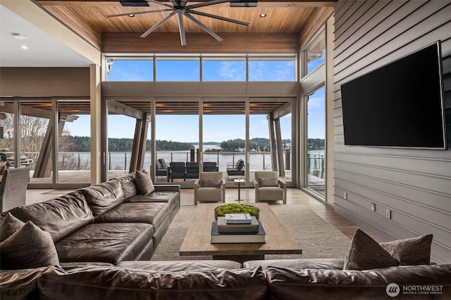 living room featuring ceiling fan, wooden ceiling, and wood finished floors