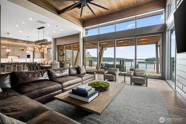 living area featuring visible vents, ceiling fan, light wood-style floors, wood ceiling, and recessed lighting