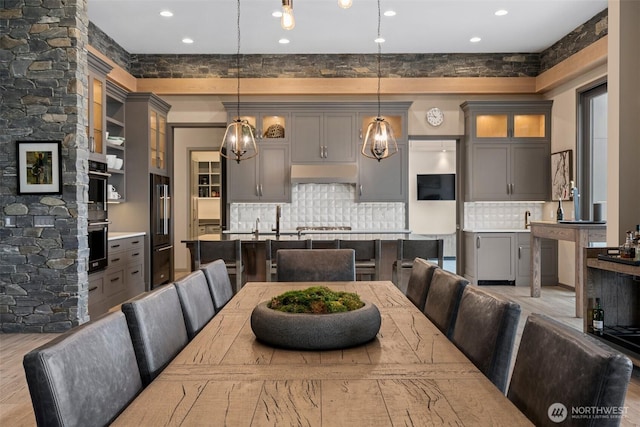 dining room featuring wood finished floors and recessed lighting
