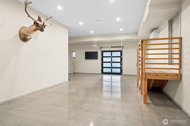 interior space with speckled floor, baseboards, and recessed lighting
