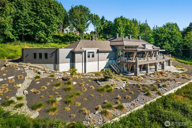 exterior space featuring a deck and stairs