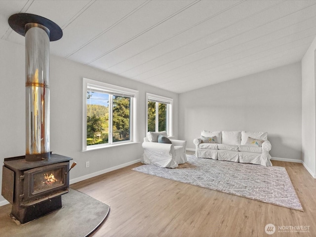5255 Apollo Rd, Langley, WA 98260 - living area with baseboards, a wood stove, and wood finished floors