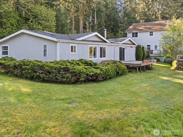 5255 Apollo Rd, Langley, WA 98260 - back of house with a deck, a playground, and a lawn