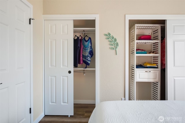 bedroom featuring baseboards and dark wood finished floors