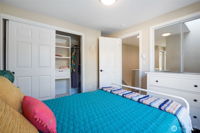 bedroom featuring a spacious closet and a closet