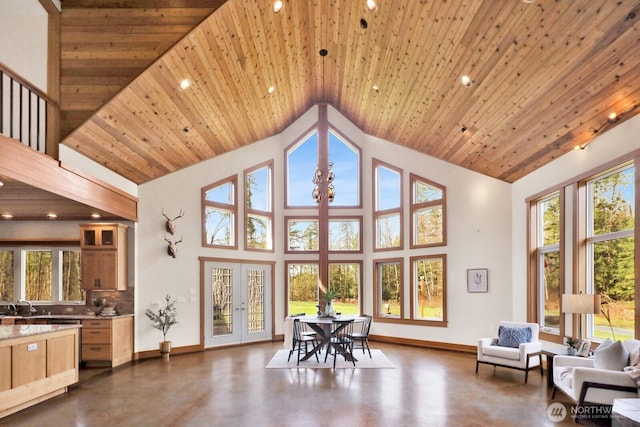 sunroom with french doors and a sink