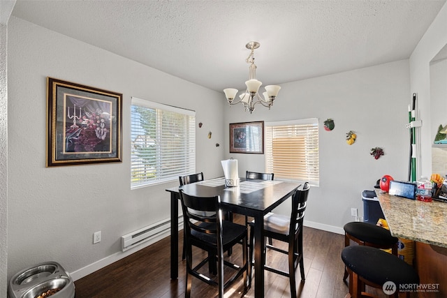 1713 17th St, Everett, WA 98201 - dining space featuring dark wood-style flooring, a notable chandelier, a baseboard heating unit, and a textured ceiling