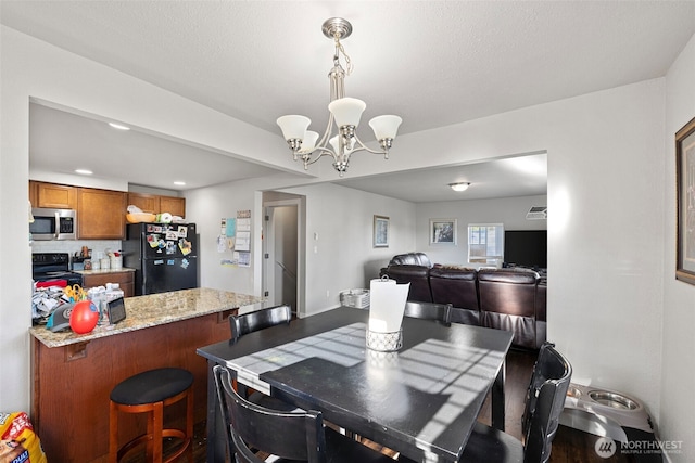 1713 17th St, Everett, WA 98201 - dining area with recessed lighting and a notable chandelier