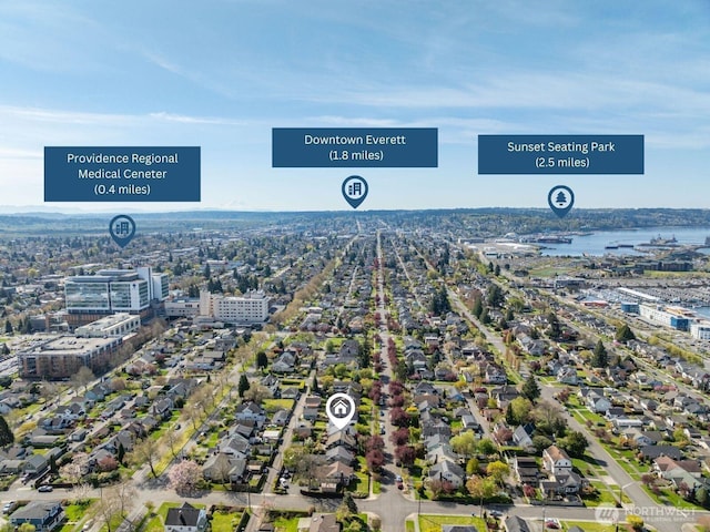view of urban area featuring a nearby body of water