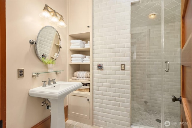 full bath featuring a shower stall