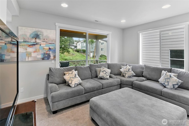 living area featuring visible vents, recessed lighting, and baseboards