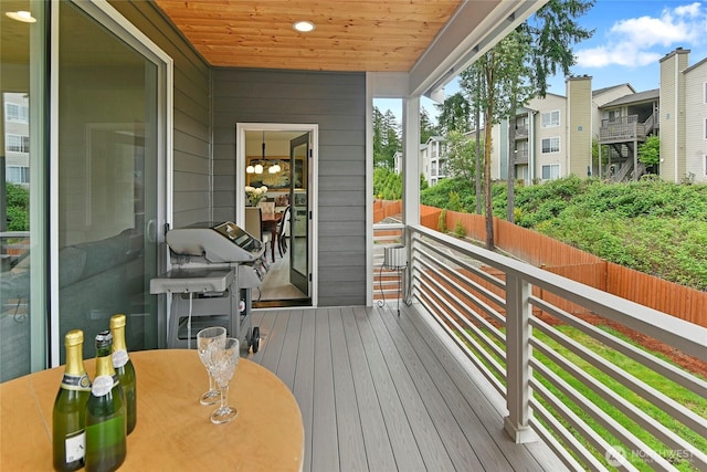 wooden deck featuring a residential view and area for grilling