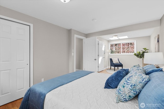 bedroom with wood finished floors