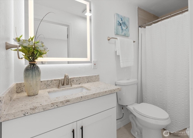 full bath featuring toilet and vanity