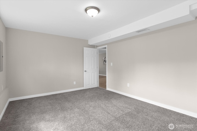 unfurnished room featuring baseboards, visible vents, and carpet floors