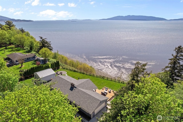 birds eye view of property featuring a water and mountain view