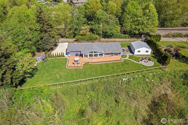 drone / aerial view featuring a forest view