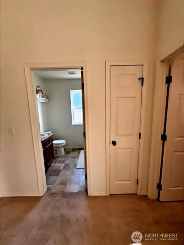 interior space featuring baseboards