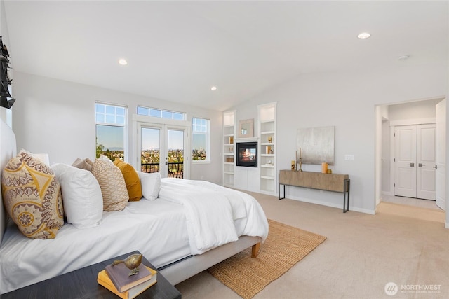 3048 39th Ave W, Seattle, WA 98199 - bedroom with access to outside, light colored carpet, recessed lighting, baseboards, and lofted ceiling