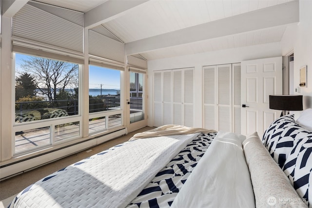 bedroom featuring a baseboard radiator, vaulted ceiling with beams, multiple windows, and access to exterior