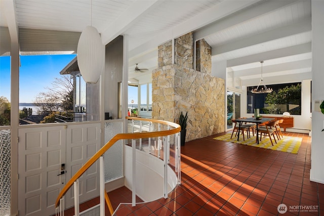 interior space with tile patterned flooring, lofted ceiling with beams, and ceiling fan with notable chandelier