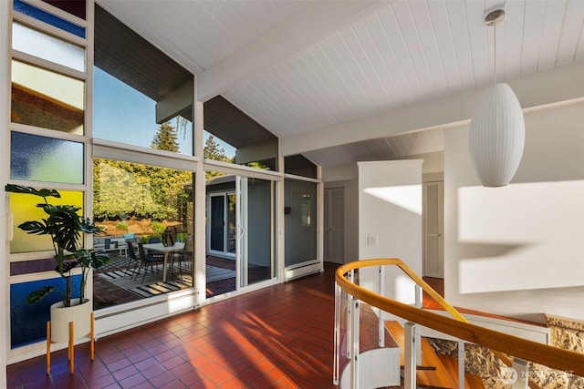 sunroom featuring a baseboard radiator and beamed ceiling
