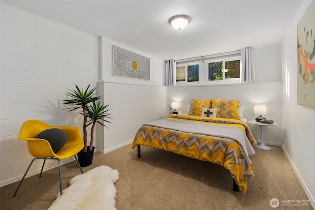 bedroom featuring baseboards and carpet