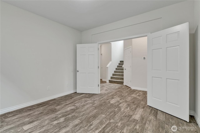 24204 SE 278th St, Maple Valley, WA 98038 - unfurnished bedroom with wood finished floors and baseboards