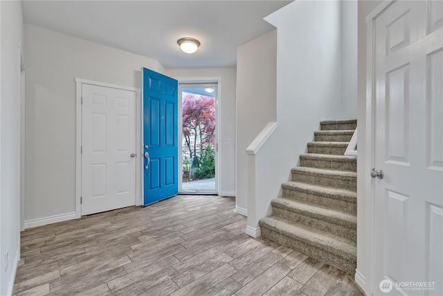 24204 SE 278th St, Maple Valley, WA 98038 - entrance foyer featuring wood finished floors, baseboards, and stairs