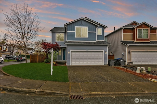 24204 SE 278th St, Maple Valley, WA 98038 - traditional home with a garage, asphalt driveway, a lawn, and board and batten siding