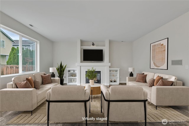 24204 SE 278th St, Maple Valley, WA 98038 - living area with a glass covered fireplace and wood finished floors
