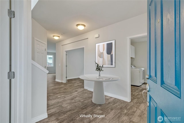 24204 SE 278th St, Maple Valley, WA 98038 - entryway featuring washer and clothes dryer, wood finished floors, and baseboards
