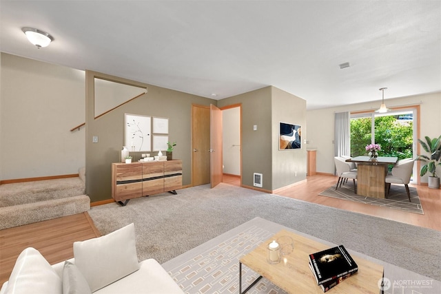 4243 Wintergreen Cir Unit 134, Bellingham, WA 98226 - living room with visible vents, carpet, stairs, and baseboards