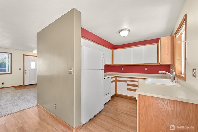 4243 Wintergreen Cir Unit 134, Bellingham, WA 98226 - kitchen featuring white cabinets, a sink, white appliances, light countertops, and light wood-style flooring