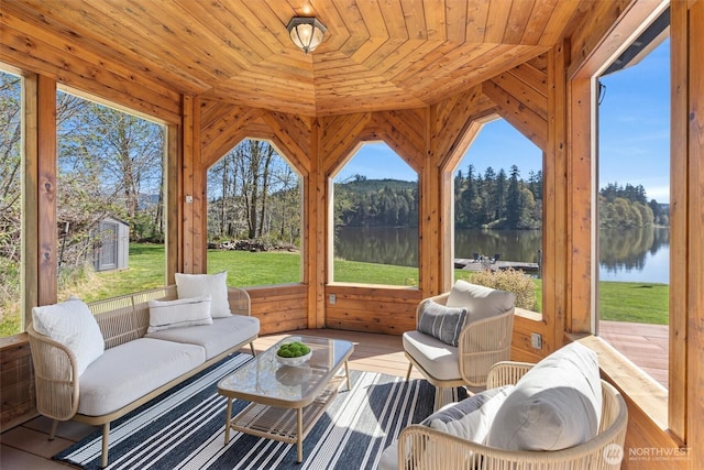 sunroom / solarium with a water view