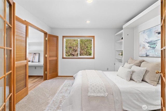 bedroom featuring wood finished floors and recessed lighting