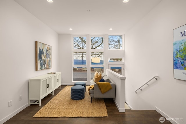 living area featuring baseboards, recessed lighting, and dark wood-style floors