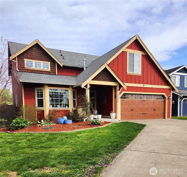9244 Carys St SE, Yelm, WA 98597 - craftsman inspired home with a front lawn, driveway, fence, an attached garage, and board and batten siding