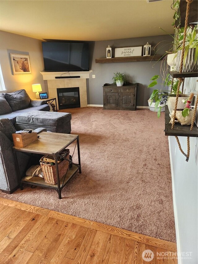 9244 Carys St SE, Yelm, WA 98597 - living room with a tile fireplace and carpet floors