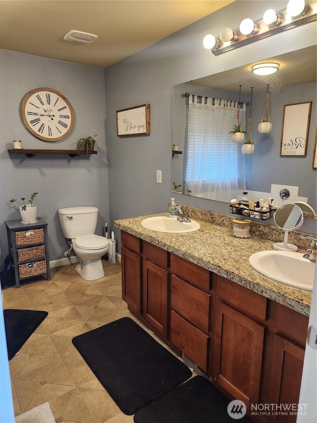 9244 Carys St SE, Yelm, WA 98597 - full bathroom with a sink, visible vents, and double vanity